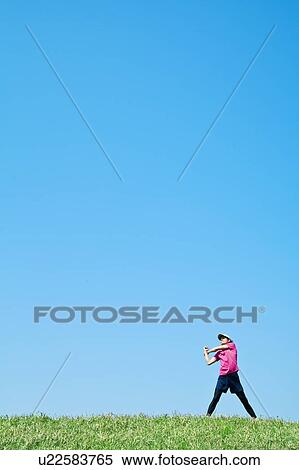 Mid Adult Man Stretching Under Blue Sky View Large Photo Image Stock Photography - Mid Adult Man Stretching Under Blue Sky. Fotosearch