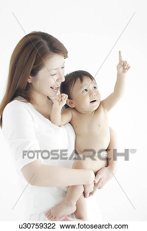 Stock Image - Mother and Baby Boy Looking Up. Fotosearch