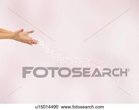Petals falling from hands View Large Photo Image Stock Image - Petals falling from hands. Fotosearch