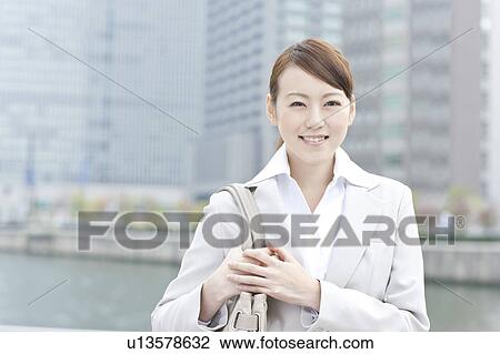 Stock Image - Portrait of a young businesswoman. Fotosearch