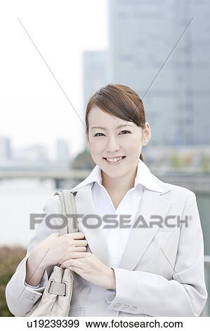 Stock Photo - Portrait of a young businesswoman. Fotosearch