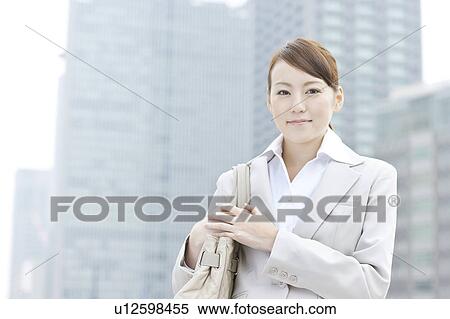 Portrait of a young businesswoman View Large Photo Image Stock Photography - Portrait of a young businesswoman. Fotosearch