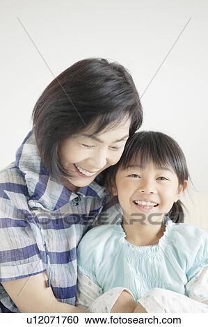 Stock Image - Portrait of Grandmother and Granddaughter. Fotosearch