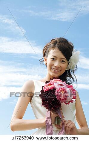 Portrait of young woman in wedding dress View Large Photo Image Stock Image - Portrait of young woman in wedding dress. Fotosearch