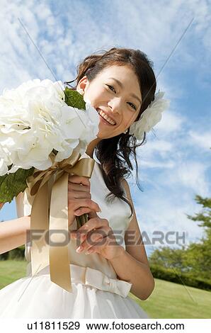 Portrait of young woman in wedding dress View Large Photo Image Stock Photo - Portrait of young woman in wedding dress. Fotosearch