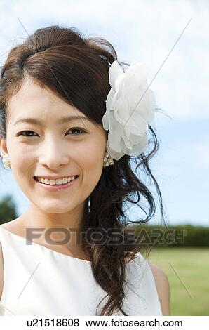 Stock Photo - Portrait of young woman in wedding dress. Fotosearch