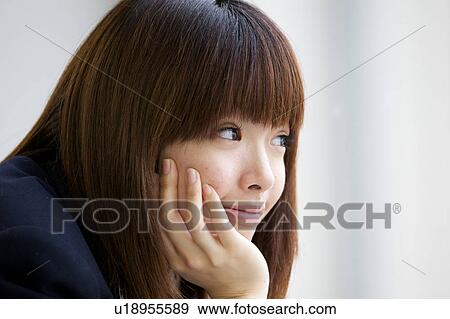 Profile of high school girl with hand on chin View Large Photo Image Stock Photo - Profile of high school girl with hand on chin. Fotosearch