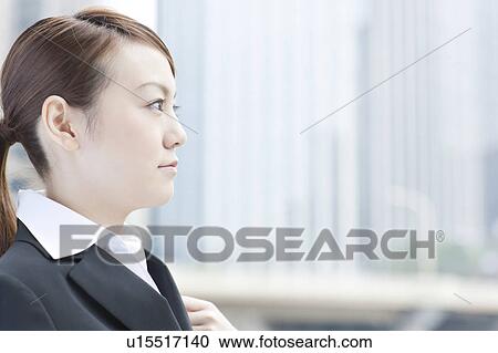 Stock Image - Profile of young businesswoman. Fotosearch