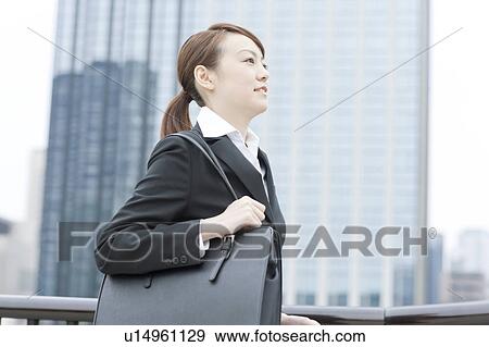 Stock Photo - Profile of young businesswoman. Fotosearch