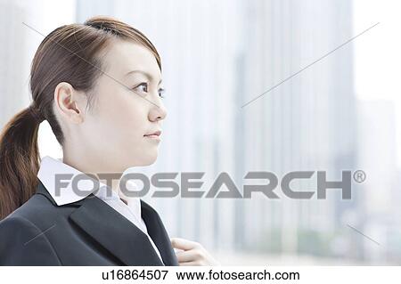 Stock Photo - Profile of young businesswoman. Fotosearch