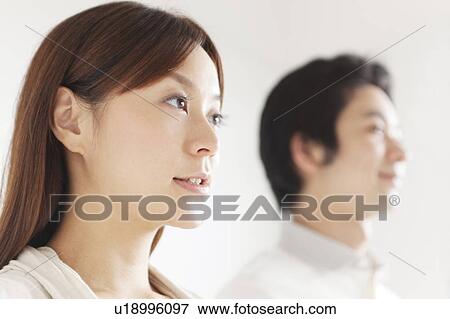 Stock Photo - Profile of young couple. Fotosearch