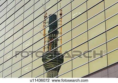 Stock Image - Reflection of Tokyo Sky Tree on a building, Sumida ward, Tokyo Prefecture, Japan. Fotosearch