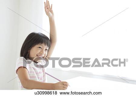 Stock Photo - Schoolgirl Raising Hand. Fotosearch