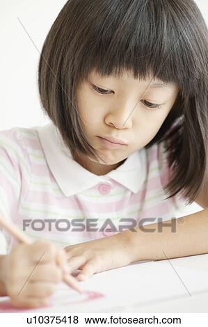 Stock Photo - Schoolgirl Studying. Fotosearch