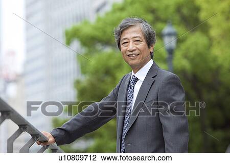 Senior businessman looking at camera View Large Photo Image Stock Image - Senior businessman looking at camera. Fotosearch