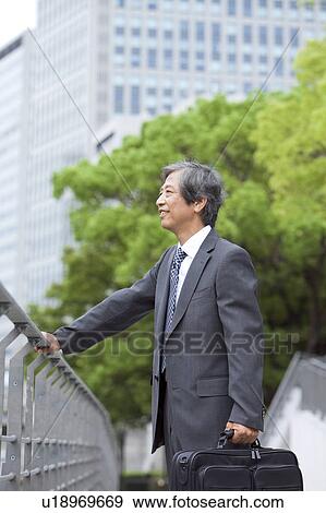 Senior businessman looking away View Large Photo Image Stock Photo - Senior businessman looking away. Fotosearch