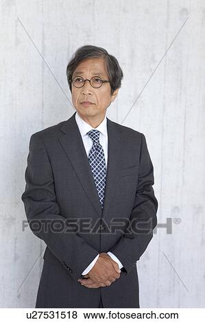 Senior businessman looking serious View Large Photo Image Stock Photo - Senior businessman looking serious. Fotosearch