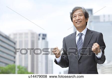 Senior businessman making fists View Large Photo Image Stock Photo - Senior businessman making fists. Fotosearch