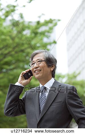 Senior businessman on cell phone View Large Photo Image Picture - Senior businessman on cell phone. Fotosearch
