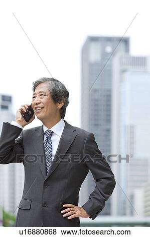 Senior businessman on cell phone View Large Photo Image Stock Photo - Senior businessman on cell phone. Fotosearch