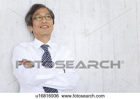 Senior businessman with arms crossed View Large Photo Image Stock Photograph - Senior businessman with arms crossed. Fotosearch