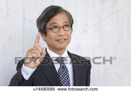 Senior businessman with number one sign View Large Photo Image Stock Photography - Senior businessman with number one sign. Fotosearch