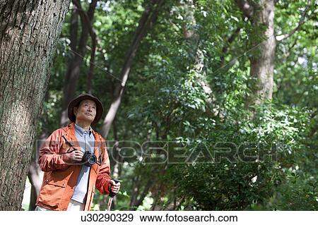 Senior man with camera View Large Photo Image Stock Photo - Senior man with camera. Fotosearch