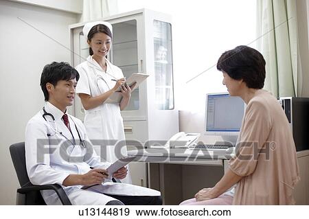 Stock Photo - Senior Woman Seeing Doctor. Fotosearch