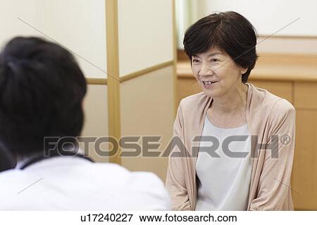 Stock Photo - Senior Woman Seeing Doctor. Fotosearch