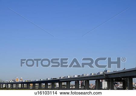 Picture - Skyline of Edogawa ward showing traffic on highway, Tokyo Prefecture, Japan. Fotosearch