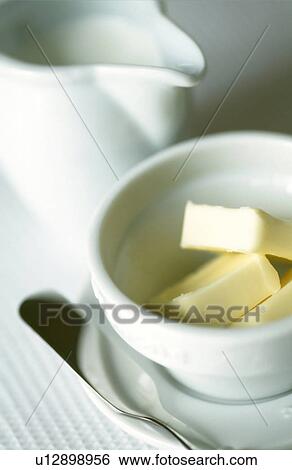 Sliced butter in a bowl View Large Photo Image Stock Photograph - Sliced butter in a bowl. Fotosearch