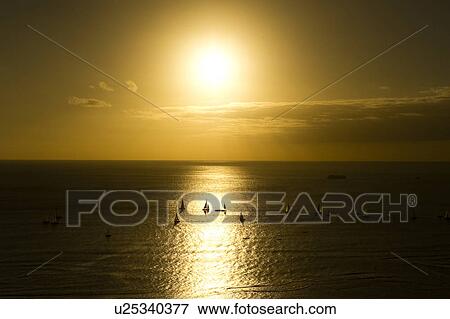 Stock Photo - Sun Setting Over Sea. Fotosearch