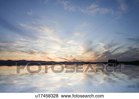 Stock Photo - Sunset Over Water. Fotosearch