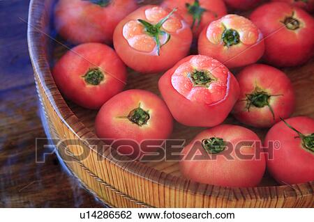 Stock Image - Tomatoes in water. Fotosearch