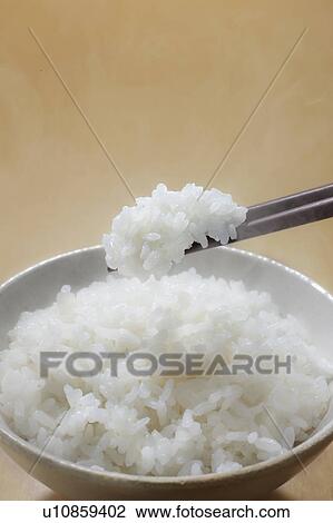 Stock Image - White rice in a bowl. Fotosearch