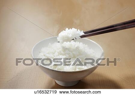 White rice in a bowl View Large Photo Image Stock Photo - White rice in a bowl. Fotosearch