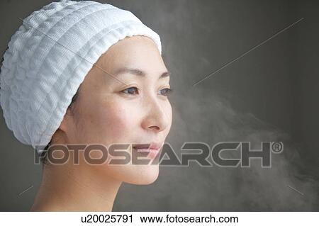 Woman steaming her face View Large Photo Image Stock Image - Woman steaming her face. Fotosearch