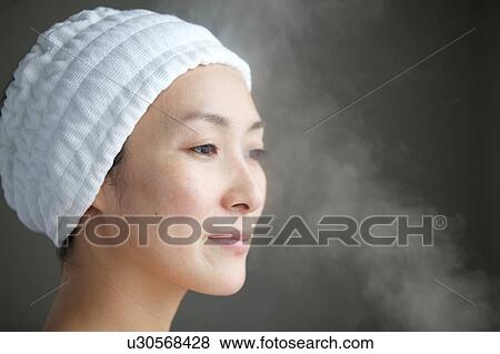 Stock Photo - Woman steaming her face. Fotosearch