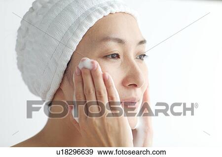 Woman washing face View Large Photo Image Stock Photo - Woman washing face. Fotosearch