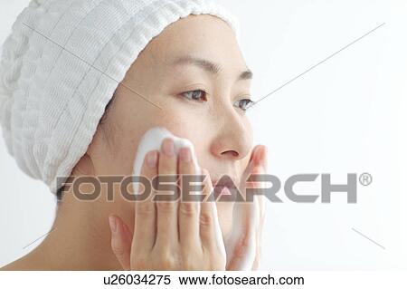 Woman washing face View Large Photo Image Stock Photography - Woman washing face. Fotosearch