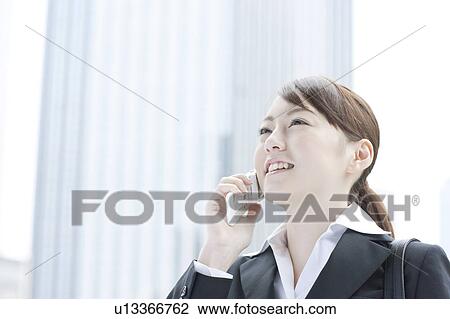 Young businesswoman on cell phone View Large Photo Image Stock Image - Young businesswoman on cell phone. Fotosearch