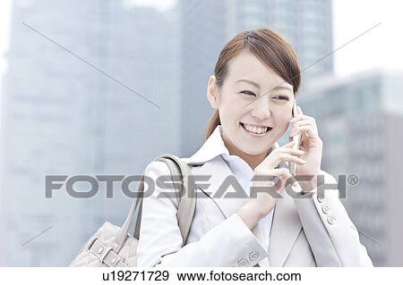 Young businesswoman on cell phone View Large Photo Image Stock Photo - Young businesswoman on cell phone. Fotosearch