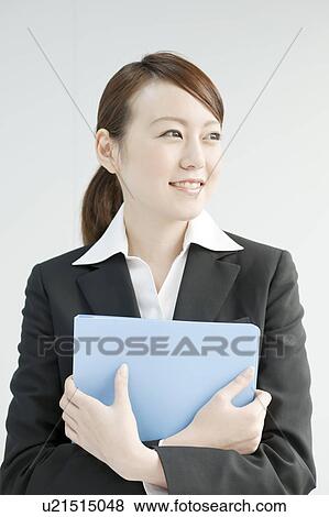 Stock Photo - Young Businesswoman with File. Fotosearch