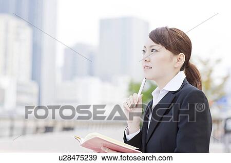 Young Businesswoman with Notebook View Large Photo Image Stock Photo - Young Businesswoman with Notebook. Fotosearch