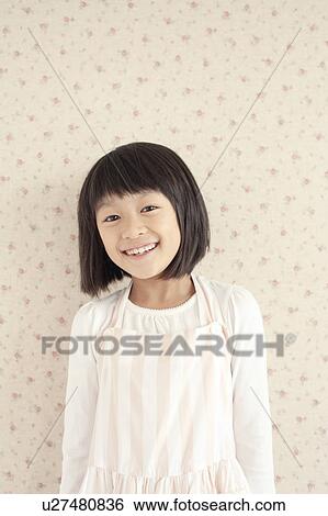 Stock Photograph - Young Cheerful Girl. Fotosearch