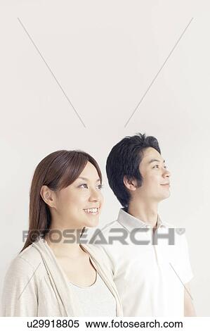 Young couple looking away View Large Photo Image Stock Photography - Young couple looking away. Fotosearch