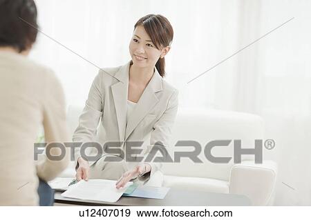 Young Female Consultant with Client View Large Photo Image Stock Photo - Young Female Consultant with Client. Fotosearch
