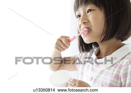 Young Girl Brushing Teeth View Large Photo Image Picture - Young Girl Brushing Teeth. Fotosearch