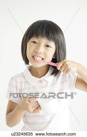 Young Girl Brushing Teeth View Large Photo Image Stock Photography - Young Girl Brushing Teeth. Fotosearch