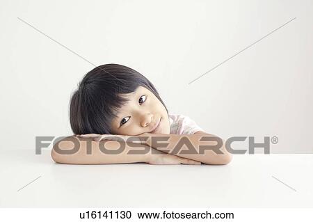 Young Girl Resting on Table View Large Photo Image Stock Image - Young Girl Resting on Table. Fotosearch
